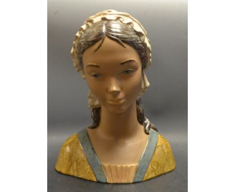 A Lladro bust of a lady wearing a bonnet 