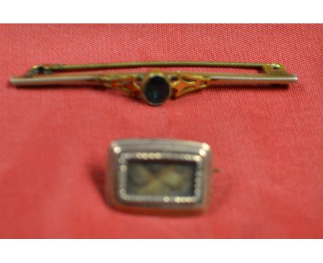 A George III hair work mourning brooch, rectangular platted panel, unmarked rose coloured rope twist and rounded rectangular 