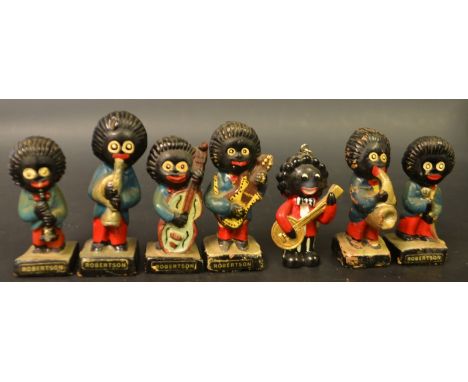 A Robertsons Gollywog musician figure, Saxophone, black plinth base; another, Clarinet; Base, Guitar; others; etc (7)