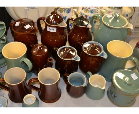 A Denby stoneware Manor Green pattern hot water jug, milk and sugar, cups and saucers, a stilton jar and cover, large taperin