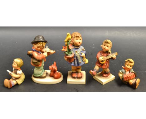 A  Goebel figure puppy love, others including congratulations, choir sing etc (5)
