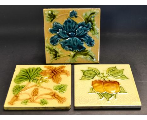 Tiles - an early 20th  century dust pressed tile,  tube lined with large blue flowerhead and foliage, 15cm square;  others, s
