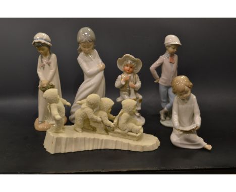 A Nao Spanish porcelain figure young boy and his dog; others similar (6)