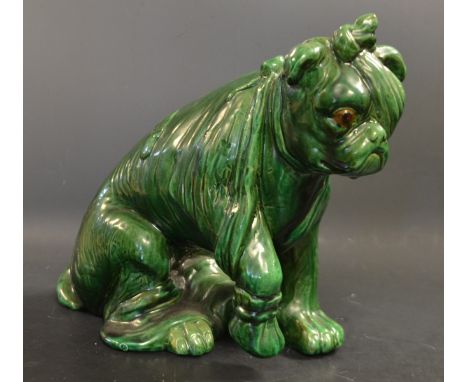 A Bretby model, After the Battle, an injured bulldog, he sits with wearing an eye patch and lifting his paw, green glaze,  ma