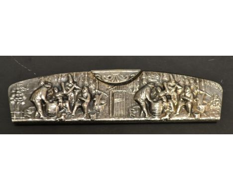 An Edwardian cased comb embossed with figures 
