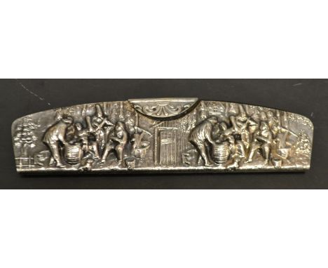 An Edwardian cased comb embossed with figures 