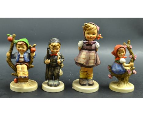 A Goebel figure with a ladder, a pair of Goebel children on branches  etc (4)