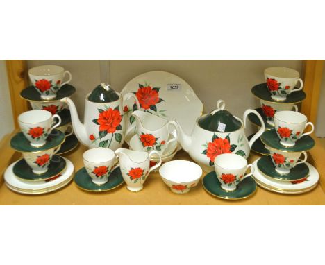A Royal Albert Tahiti tea and coffee service for six, with six teacups and six coffee cups, tea pot, coffee pot, milk and sug