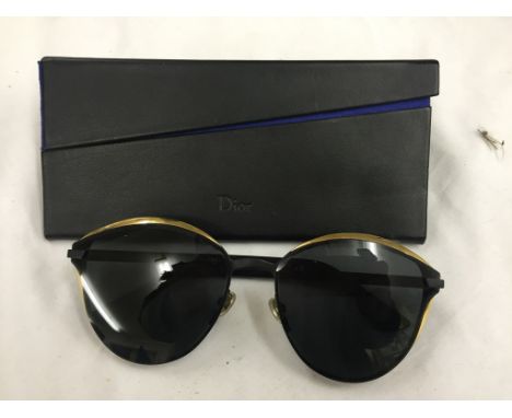 A pair of cased Christian Dior sunglasses