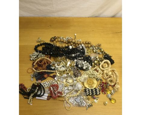 A box of vintage dress jewellery