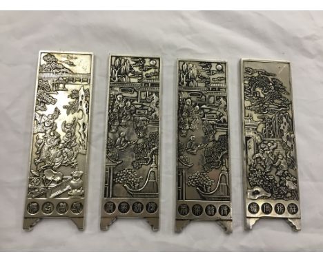 Four Chinese silver plated scroll weights