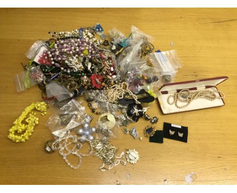 A box of vintage dress jewellery