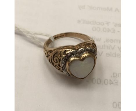 A 9ct opal heart ring