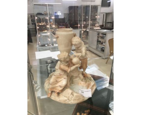 A Royal Worcester blush ivory figure of a girl sipping drink from a jug held by a gentleman, by Hadley