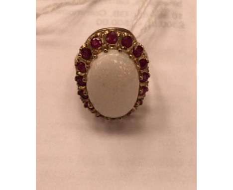 A 9ct opal and ruby dress ring