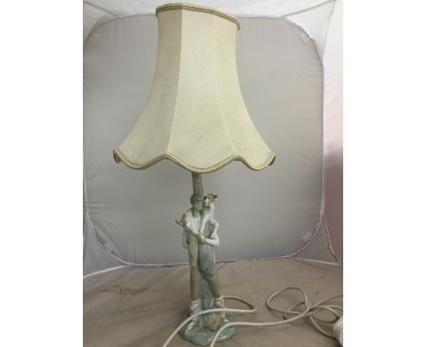 A Lladro lamp base a shepherd holding a goat