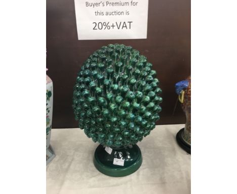 A large green Majolica glazed pineapple finial