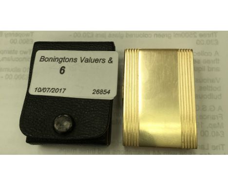 A gold-plated pop-up lighter by Elizabeth James