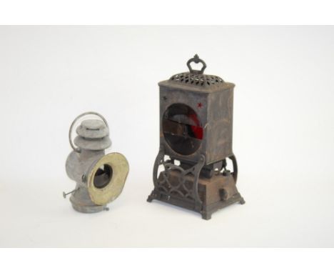 A small unmarked railway lamp, plus a lamp or heater with stained glass inserts and stamped 'Rippingilles Patent'