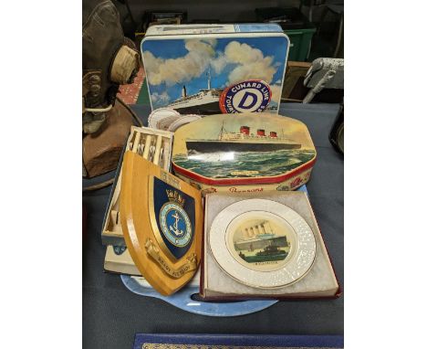 A collection of maritime themed items to include Maryport cadets plaque, Titanic plate,  vintage tins, Cunard stickers