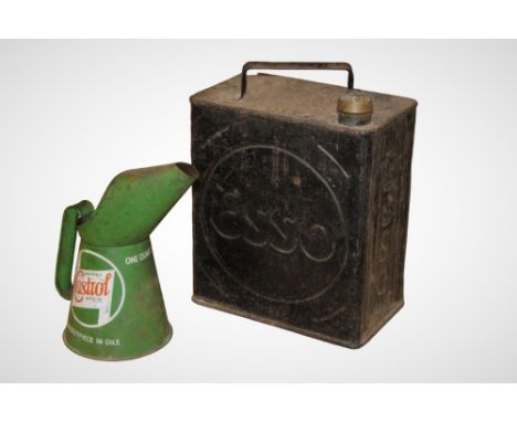 A vintage metal Esso oil can together with a Castrol pouring jug