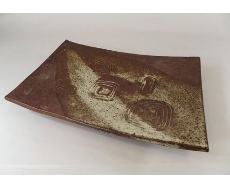 JANET LEACH.
A Janet Leach stoneware dish on twin feet with incised & poured decoration. Impressed personal & Leach Pottery m