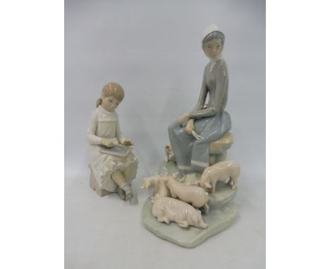 A Lladro porcelain group of a lady surrounded by piglets, 10 1/2" h plus a smaller Nao porcelain figure of a young girl drawi