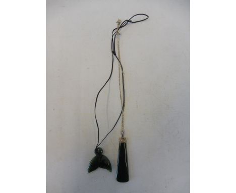 A New Zealand jade pendant and one other.