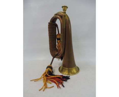 A military copper and brass mounted bugle.