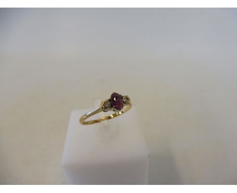 A 9ct gold diamond and ruby ring, size K/L, 1.3g.