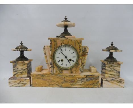 An Art Deco marble clock garniture, the clock being 13" w.
