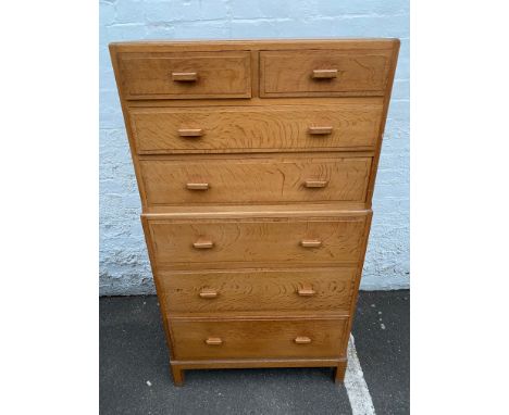 A Heals light oak chest of two short over five long drawers, one drawer with an inset celluloid disc for Heals, 30 3/4" w x 5