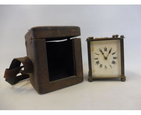 A cased brass carriage clock of small size, with French movement.