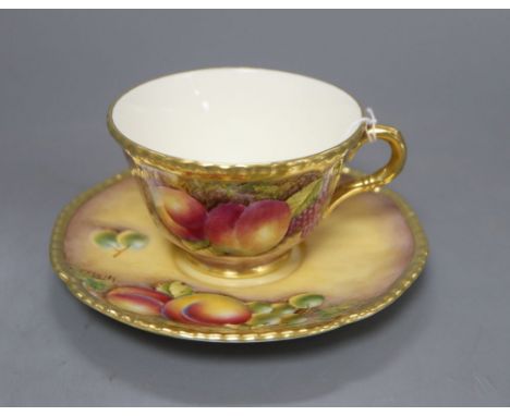 A Royal Worcester fruit painted cup and saucer, saucer signed L K Till, cup signed A Kendry