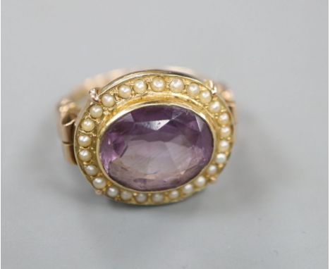 A 19th century style 14k, oval cut amethyst and seed pearl set dress ring, size O, gross 6.1 grams.