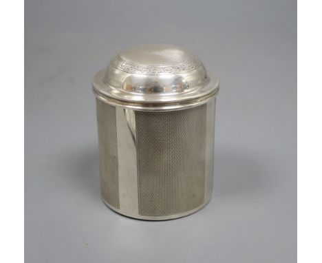 A 1920's engine turned cylindrical cigarette dispenser, London, 1929, 9.5cm, 8oz.