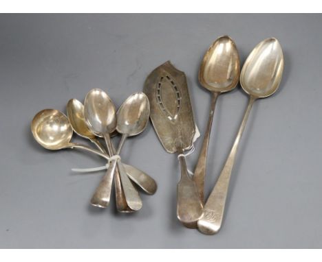 Mixed silver flatware, including two George III basting spoons, a George III fish slice, two 19th century tablespoons, two 19