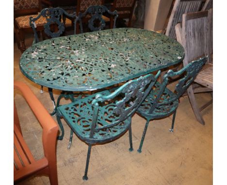 A painted metal garden table, W.136cm, D.76cm, H.68cm, bench seat and two chairs