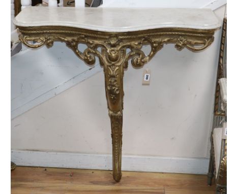 A 19th century French carved giltwood and gesso console table with serpentine marble top, W.94cm