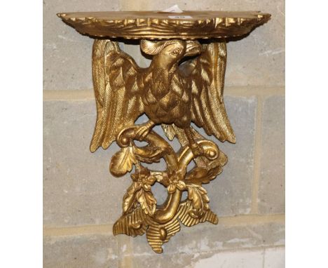 A George III style carved giltwood eagle and foliate design bracket, W.32cm, H.42cm