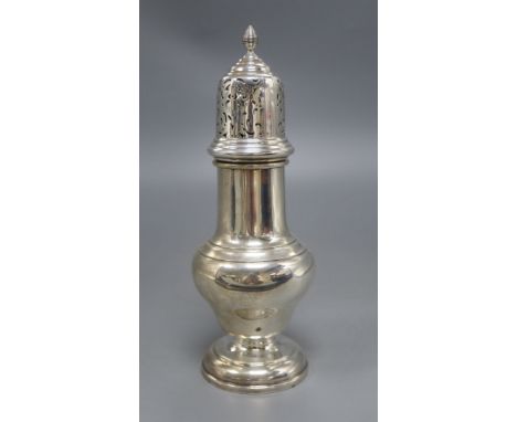 A silver vase shape sugar shaker, with pierced domed cover, ribbed finial on circular base, Birmingham 1932, 7.6oz., height 2