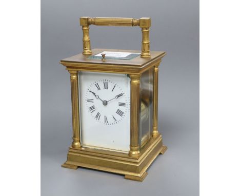 A brass cased repeating carriage clock, height with handle down 15cm