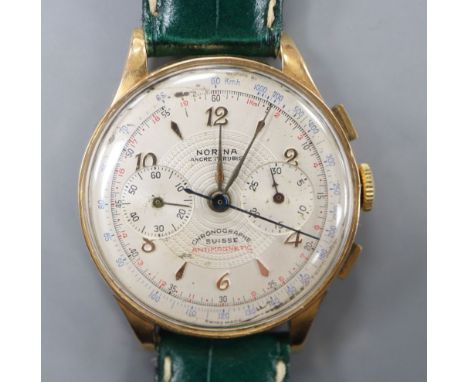 A gentleman's 1950's? 18k Norina chronograph manual wind wrist watch, on later strap.CONDITION: Case diameter 37mm ex. crwon.