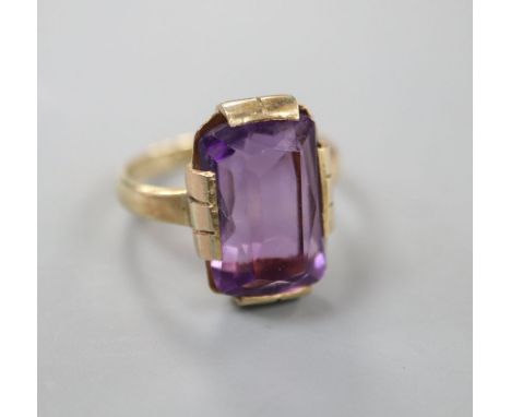 A 9ct gold and amethyst set dress ring, size K, gross 4.2 grams.CONDITION: Old repairs to the underside of the ring head.