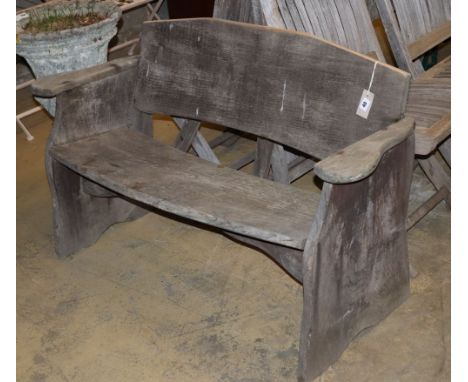 A rustic wood garden bench, W.120cm, D.43cm, H.74cm