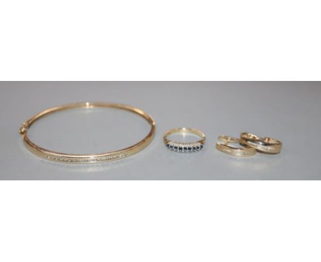 A modern 9ct gold sapphire and diamond ring, a modern 10k and diamond bangle and pair of matching, earrings gross 12 grams.