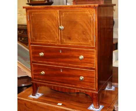 A Regency inlaid mahogany cabinet, fitted doors and two drawers, (formerly a commode chest), W.61cm