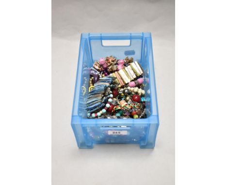 Two vintage Mother of Pearl and iridescent expandable bracelets, a colourful shell form bracelet, plus contemporary bead jewe
