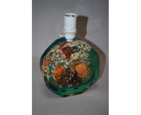 A vintage resin lamp having crabs, starfish and shells inset.