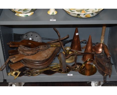 A collection of vintage and antique items, including bellows, copper measures, flat iron and stand, candlestick and more.